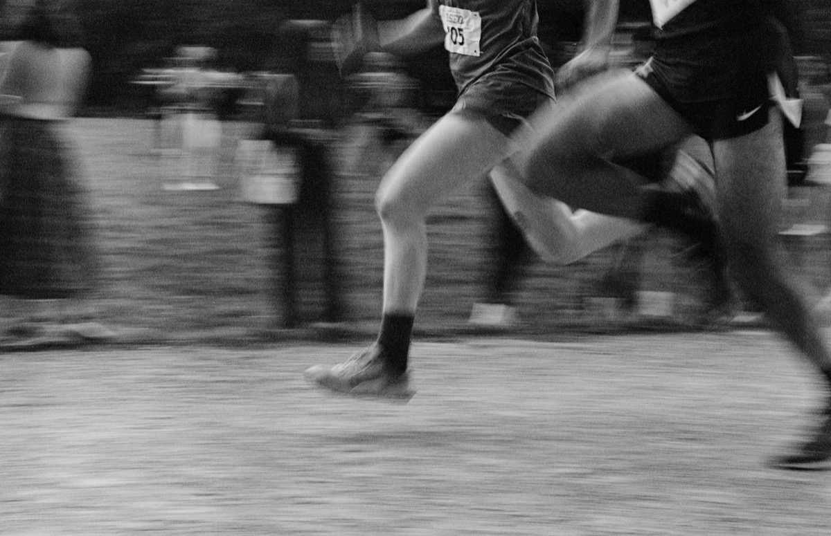 Runners racing side by side on a track