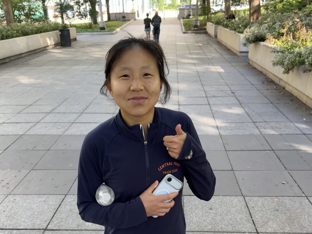 Maryann giving a thumbs up after the Chicago Marathon
